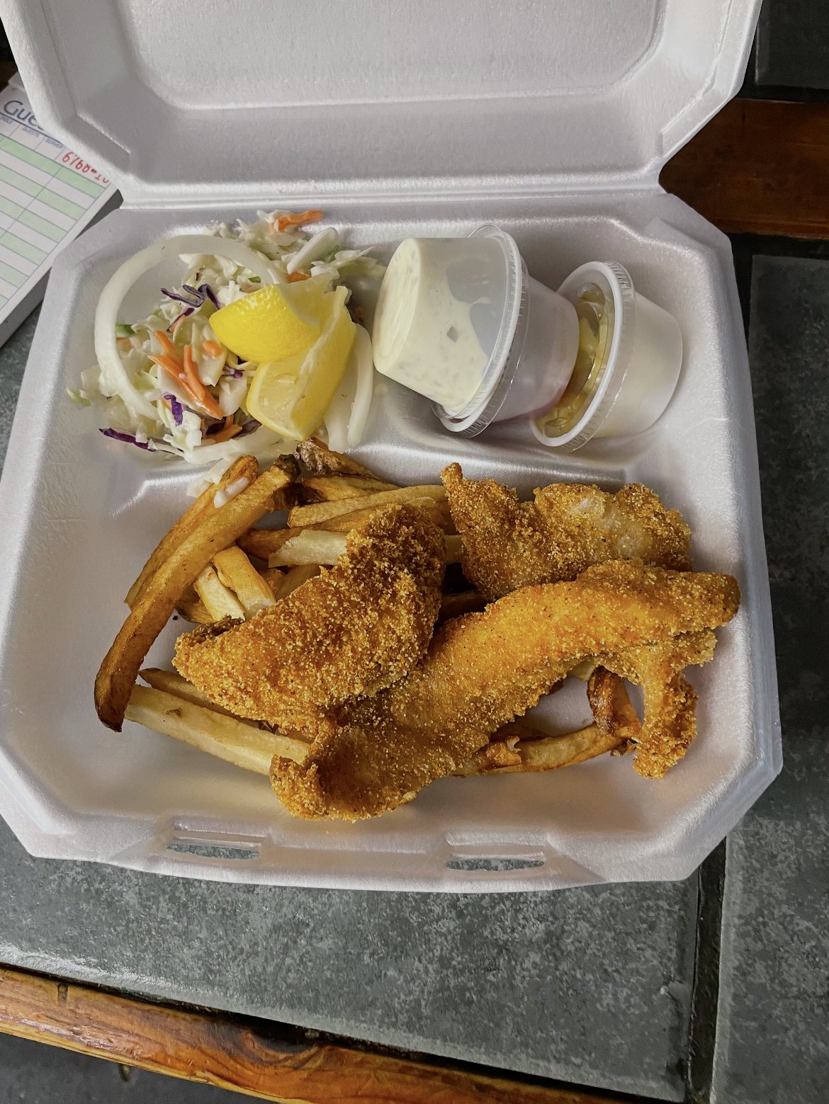 Fried catfish plate with fries and coleslaw